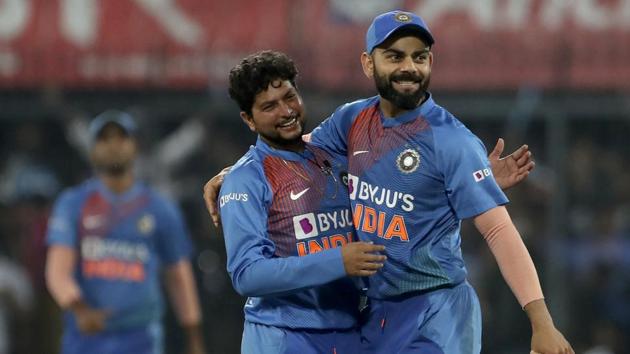 India's Kuldeep Yadav, left, celebrates with captain Virat Kohli.(AP)