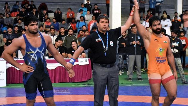 Referee raises the hand of Wrestler Gurpreet Singh after his victory against two-time World Junior Championships medallist Sajan Bhanwal. (PTI) Referee raises the hand of Wrestler Gurpreet Singh after his victory against two-time World Junior Championships medallist Sajan Bhanwal. (PTI)