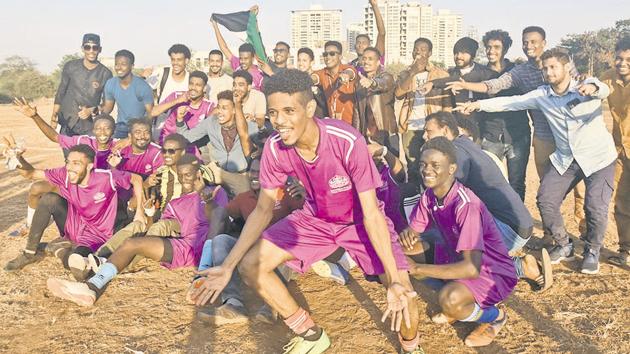 Students of Sudan celebrate after winning the football final played against Afghanistan during the International Youth Festival organised at SSPU ground in Pune on Friday.(PRATHAM GOKHALE/HT)