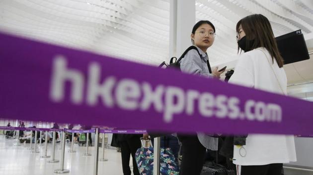 Passengers wait at the check-in counter of Hong Kong Express Airways at the Hong Kong International Airport. Image used for representational purpose only.(AP)