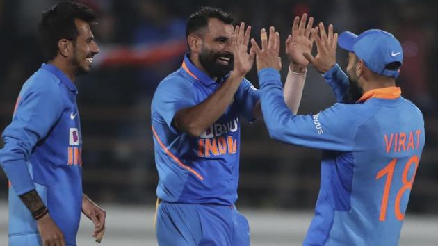 India's Mohammed Shami, second right, Yuzvendra Chahal, second left, Kedar Jadhav, left, and captain Virat Kohli celebrate.(AP)