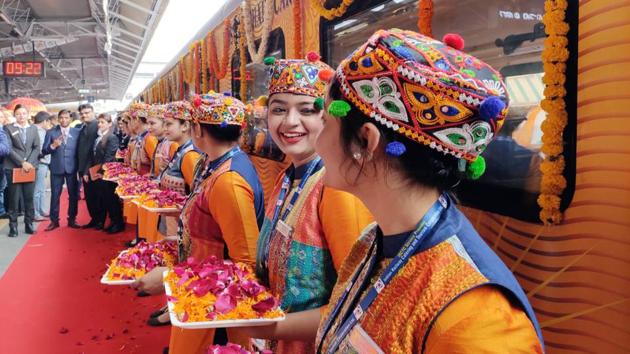 IRCTC employees are seen with flowers to welcome guests during the inaugural run of the Ahmedabad-Mumbai Tejas Express. Bookings for the train can be exclusively done either through IRCTC website, the mobile app Irctc Rail Connect, or IRCTC authorised agents. (ANI)