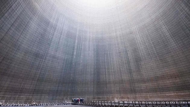 A group visiting the inside of a cooling tower at Mehrum coal-fired power plant in Hohenhameln, Germany. (Julian Stratenschulte/AFP) A group visiting the inside of a cooling tower at Mehrum coal-fired power plant in Hohenhameln, Germany. (Julian Stratenschulte/AFP)