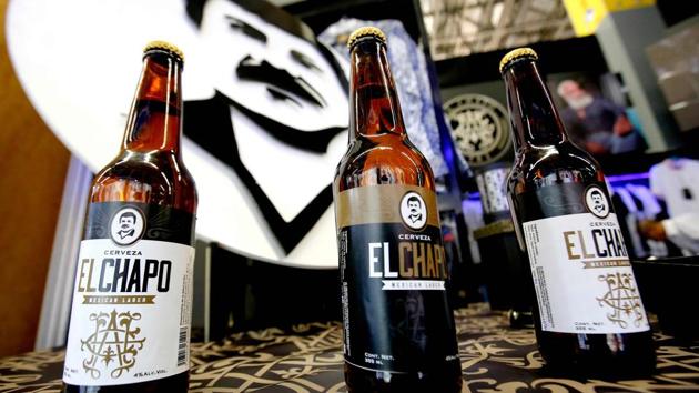 Bottles of beer of ‘El Chapo 701’, a line in clothing, jewellery and liquor bearing the nickname of the jailed Mexican drug lord Joaquin “El Chapo” Guzman Loera, are displayed during the 72 edition of IM Intermoda Mexico fashion fair in Guadalajara, Mexico. (Ulises Ruiz/AFP) Bottles of beer of ‘El Chapo 701’, a line in clothing, jewellery and liquor bearing the nickname of the jailed Mexican drug lord Joaquin “El Chapo” Guzman Loera, are displayed during the 72 edition of IM Intermoda Mexico fashion fair in Guadalajara, Mexico. (Ulises Ruiz/AFP)