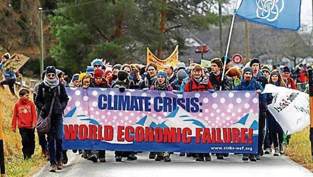 Climate activists start a hike to the Alpine resort of Klosters in Landquart, Switzerland, on Sunday.(Reuters) Climate activists start a hike to the Alpine resort of Klosters in Landquart, Switzerland, on Sunday.(Reuters)