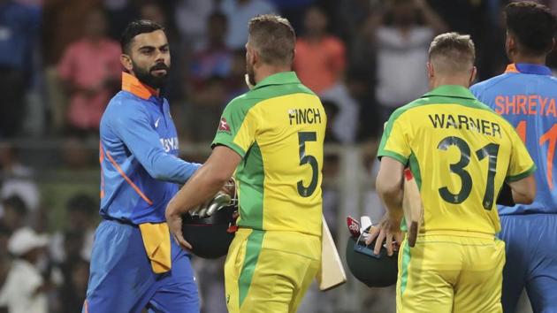 Australia's captain Aaron Finch is congratulated by Indian captain Virat Kohli.(AP)