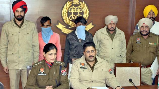 Police addressing the media after the arrest of two men from Uttar Pradesh, involved in online fraud, in Mohali on Saturday.(HT Photo.)