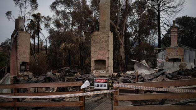 A danger sign is hung in front of an area cordoned off by the Emergency State Services. Wildfires on a massive scale have killed 29 people since September in Australia, fuelled by record temperatures and tinder-dry conditions, turning swathes of farms and woodlands black, and blanketing the sky in haze. (Alkis Konstantinidis/REUTERS)