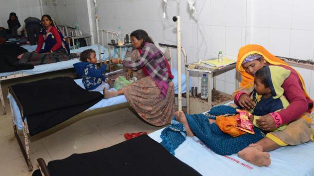 Sick children in the laps of their mothers undergoing treatment at a government-run hospital. Image used for representational purpose only. (AP) Sick children in the laps of their mothers undergoing treatment at a government-run hospital. Image used for representational purpose only. (AP)