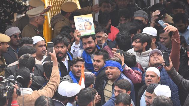 Bhim Army chief Chandrashekhar Azad is seen holding a copy of the Constitution of India as he joins a protest against Citizenship Amendment Act (CAA) at Jama Masjid in New Delhi. (Raj K Raj/HT Photo) Bhim Army chief Chandrashekhar Azad is seen holding a copy of the Constitution of India as he joins a protest against Citizenship Amendment Act (CAA) at Jama Masjid in New Delhi. (Raj K Raj/HT Photo)