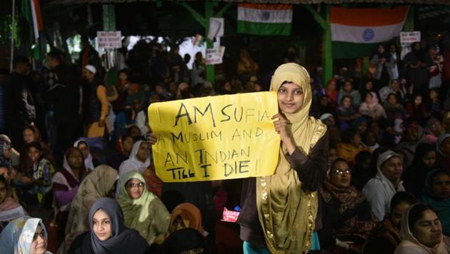 A girl holds a placard as women continue their sit-in protest against Citizenship Amendment Act (CAA), National Population Register (NPR), National Register of Citizens (NRC) at Park Circus Maidan in Kolkata.(Photo: Samir Jana/ Hindustan Times)