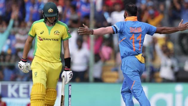 India's Mohammed Shami, right, celebrates the dismissal of Australia's Pat Cummins. (AP) India's Mohammed Shami, right, celebrates the dismissal of Australia's Pat Cummins. (AP)