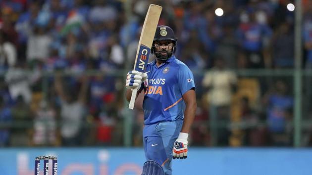 India's Rohit Sharma raises his bat to celebrate scoring a century. (AP) India's Rohit Sharma raises his bat to celebrate scoring a century. (AP)