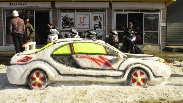 A snow sculpture depicting a car is seen at Budgam district, Jammu and Kashmir. (HT Photo) A snow sculpture depicting a car is seen at Budgam district, Jammu and Kashmir. (HT Photo)