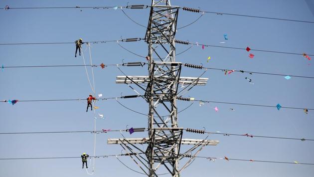 Workers of Torrent Power Limited remove kites and thread tangled up in electric power cables after the end of the kite flying season in Ahmedabad. (Amit Dave/REUTERS) Workers of Torrent Power Limited remove kites and thread tangled up in electric power cables after the end of the kite flying season in Ahmedabad. (Amit Dave/REUTERS)