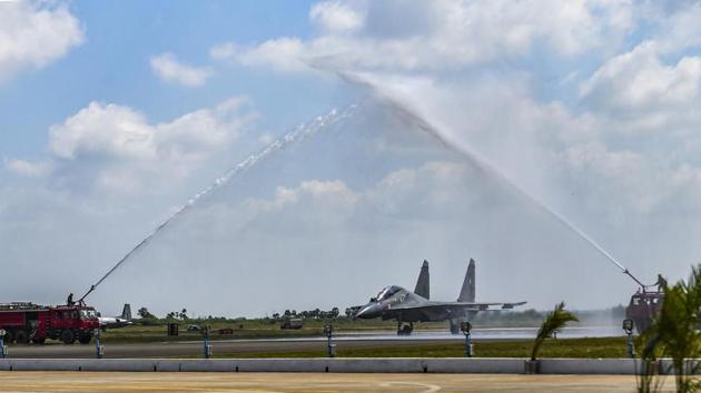 Sukhoi-30MKI fighter aircraft squadron being accorded water salute during its induction ceremony into the Indian Air Force at the Thanjavur airbase.(PTI)