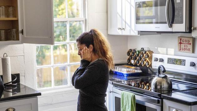 Mario Campos stands in the kitchen of El Refugio, an organization that houses families visiting detainees at the Stewart Detention Centre. Campos doesn’t have money to pay for a lawyer, so her son is representing himself. Campos, her daughter-in-law and two grandchildren stayed at El Refugio, a house run by volunteers who help with food and gas. (David Goldman / AP)