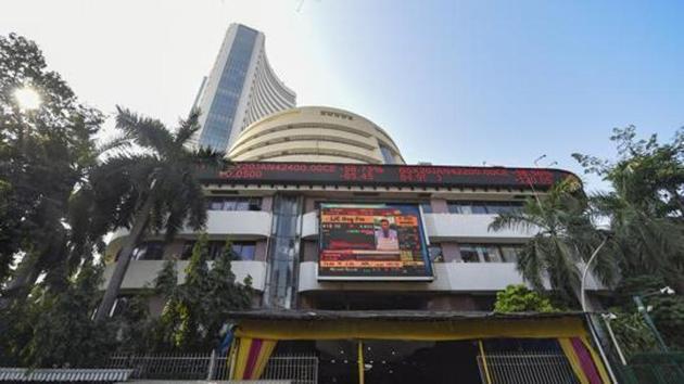 A view of the stock prices displayed on a digital screen outside BSE building in Mumbai.(PTI)