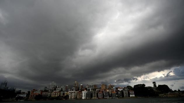 Storm clouds gather over Sydney Harbour. “Severe thunderstorms are likely to produce damaging, locally destructive winds, large, possibly giant hailstones and heavy rainfall that may lead to flash flooding in the warning area over the next several hours,” the bureau said. (Peter Parks / AFP)