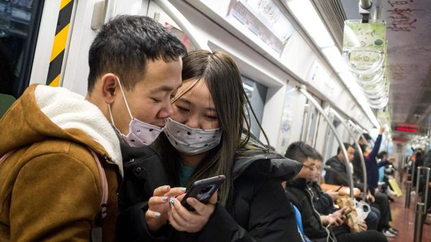 Subway passengers wear protective masks in Beijing on January 21, 2020. (AFP) Subway passengers wear protective masks in Beijing on January 21, 2020. (AFP)
