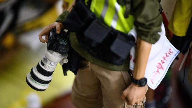 Some of the parts came from the duo’s own military toy collections or were made with 3D printers. Other elements were built from scratch. For a reporter figurine, the pair hand-stitched a tiny camera bag while popsicle sticks have been transformed into wooden shields used by hardcore activists. (Philip Fong / AFP) 