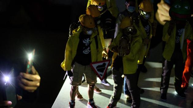 “Hong Kong people gave us the opportunity to create these figures and we hope to use the money to help protesters in return,” Charlie said. In darks times, he added, the models can raise spirits. “We hope they can console people emotionally,” he said. (Philip Fong / AFP) 