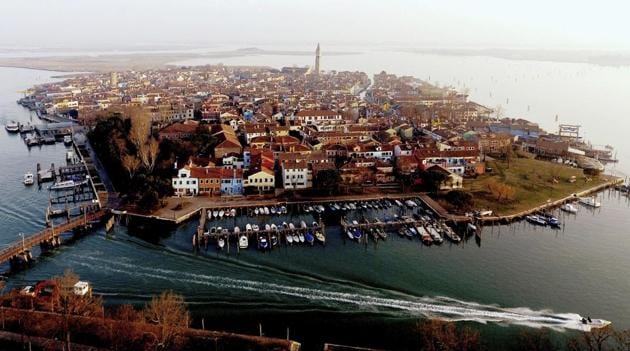 This image taken on Thursday, Jan. 16, 2020, shows an overview of the Burano island, Italy. A trio of islands in Venice's northern lagoon are revamping traditions to counter depopulation. (AP) This image taken on Thursday, Jan. 16, 2020, shows an overview of the Burano island, Italy. A trio of islands in Venice's northern lagoon are revamping traditions to counter depopulation. (AP)