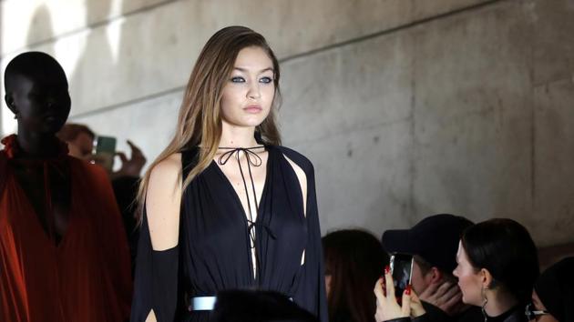 Model Gigi Hadid presents a creation by designer Bruno Sialelli as part of his Fall/Winter 2020/2021 collection show.  (REUTERS) 