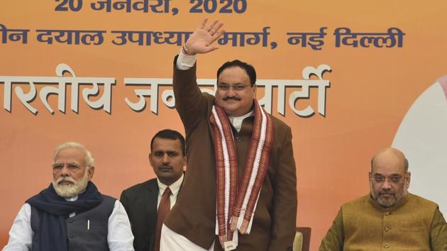 Newly elected BJP President JP Nadda waves at the gathering in the presence of Prime Minister Narendra Modi and Union Home Minister Amit Shah, at BJP headquarters, in New Delhi. (Sanjeev Verma/HT PHOTO) Newly elected BJP President JP Nadda waves at the gathering in the presence of Prime Minister Narendra Modi and Union Home Minister Amit Shah, at BJP headquarters, in New Delhi. (Sanjeev Verma/HT PHOTO)