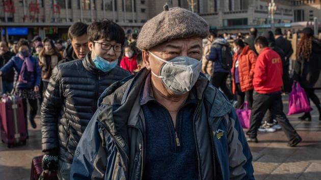 China has confirmed human-to-human transmission in the outbreak of a new SARS-like virus as the number of cases soared and the World Health Organization said it would consider declaring an international public health emergency.(AFP photo) China has confirmed human-to-human transmission in the outbreak of a new SARS-like virus as the number of cases soared and the World Health Organization said it would consider declaring an international public health emergency.(AFP photo)