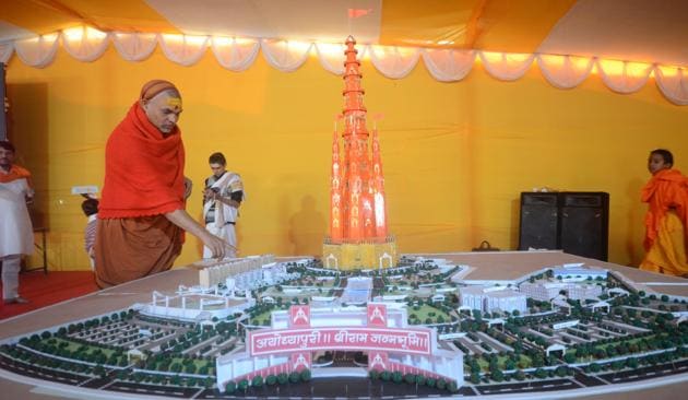 Swami Avimukteshwaranand showing the Ram temple model proposed by Shankaracharya Swami Swaroopanand Saraswati at the Magh Mela in Prayagraj.(HT Photo)