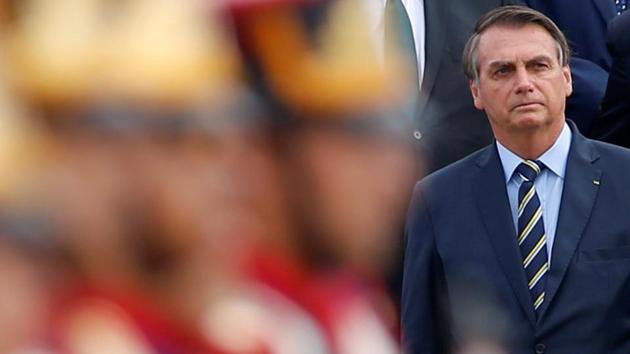 Brazil's President Jair Bolsonaro attends a ceremony of the hoisting the national flag in front of the Alvorada Palace in Brasilia, Brazil.(REUTERS)