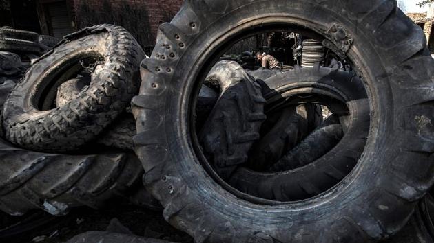 Stacked tyres at a rubber recycling workshop in the village of Mit al-Harun. Azab’s workshop, with a handful of workers, processes up to 10 tyres per day, producing between 80-120 baskets. Azab’s brother, Haitham, said the job was “exhausting”. (Khaled Desouki / AFP) Stacked tyres at a rubber recycling workshop in the village of Mit al-Harun. Azab’s workshop, with a handful of workers, processes up to 10 tyres per day, producing between 80-120 baskets. Azab’s brother, Haitham, said the job was “exhausting”. (Khaled Desouki / AFP)