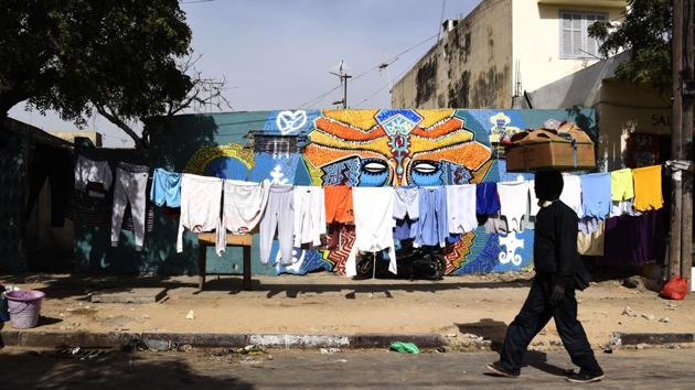 Petit added that artists approach families and ask permission before painting, often offering them dinner in return. “It’s not a contract with a motorway company or a commercial sign. It’s really a human contact,” she said. (Seyllou / AFP)