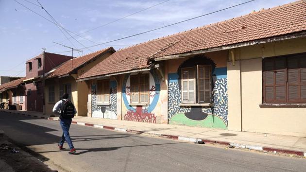 A man walks past murals. The group is also seeking to protect Medina’s old colonial-era buildings from a construction boom that is transforming Dakar. “While the Plateau was sleeping at night, Medina was waking up,” historian Ibrahima Thioub told AFP. World-renowned Senegalese singer Youssou N’Dour is from Medina, for example, and painter Kre M’Baye kept his studio there. (Seyllou / AFP)