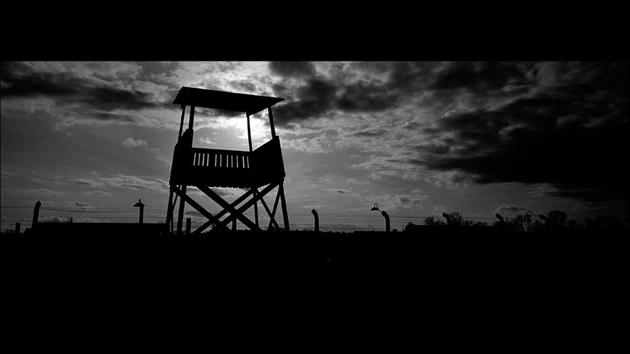 An observation tower stands inside Auschwitz Birkenau. It is Birkenau that shocks more profoundly, a flat, vast space still ringed by the silver birch trees (Birken in German) that gave the place its name. Crematoria lie in rubble but still intact are the rail tracks and watchtowers and some of the barracks where prisoners slept in cold, cramped conditions. (Markus Schreiber / AP) An observation tower stands inside Auschwitz Birkenau. It is Birkenau that shocks more profoundly, a flat, vast space still ringed by the silver birch trees (Birken in German) that gave the place its name. Crematoria lie in rubble but still intact are the rail tracks and watchtowers and some of the barracks where prisoners slept in cold, cramped conditions. (Markus Schreiber / AP)