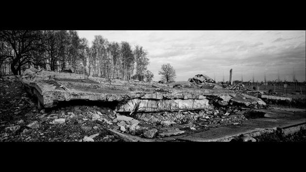 Before official anniversary commemorations, Associated Press photographer Markus Schreiber visited the site. Using a panoramic film camera, he documented the remains of the camp in a series of haunting black and white photos. (Markus Schreiber / AP) Before official anniversary commemorations, Associated Press photographer Markus Schreiber visited the site. Using a panoramic film camera, he documented the remains of the camp in a series of haunting black and white photos. (Markus Schreiber / AP)