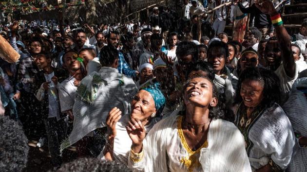 Worshippers are wetted with holy water during Timkat. For Aschalew, the tourism official, changing customs reflect a broader shift away from traditional dating habits, as Ethiopian youth explore new ways to meet partners. Aschalew described this as an “acceptable” result of modernity, but some Gondar residents told AFP they believed the old customs should be revived. (Eduardo Soteras / AFP) Worshippers are wetted with holy water during Timkat. For Aschalew, the tourism official, changing customs reflect a broader shift away from traditional dating habits, as Ethiopian youth explore new ways to meet partners. Aschalew described this as an “acceptable” result of modernity, but some Gondar residents told AFP they believed the old customs should be revived. (Eduardo Soteras / AFP)