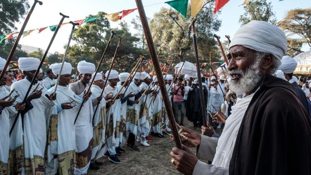 Ethiopian Orthodox Christian priests dance during the celebration. There’s even a saying—“Let a dress not meant for Timkat be shredded”—suggesting that Timkat clothes are the only ones worth keeping. “Everyone is dressed to impress,” Aschalew said. “Everyone attends Timkat clean and fresh, and this creates an opportunity for dating.” (Eduardo Soteras / AFP) Ethiopian Orthodox Christian priests dance during the celebration. There’s even a saying—“Let a dress not meant for Timkat be shredded”—suggesting that Timkat clothes are the only ones worth keeping. “Everyone is dressed to impress,” Aschalew said. “Everyone attends Timkat clean and fresh, and this creates an opportunity for dating.” (Eduardo Soteras / AFP)