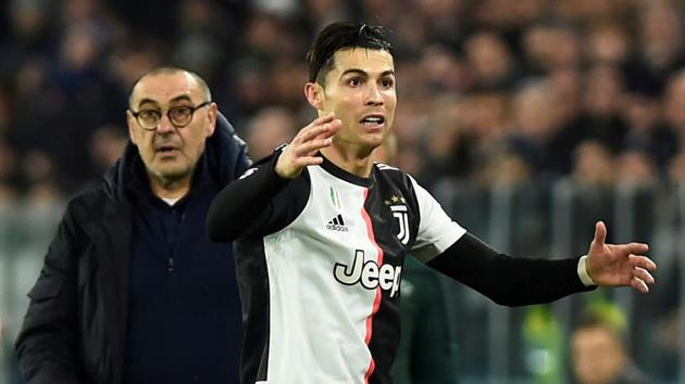 Juventus' Cristiano Ronaldo reacts as coach Maurizio Sarri looks on.(REUTERS)