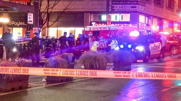 Police work the scene of a shooting on Third Avenue and Pine Street, Wednesday, Jan. 22, 2020, in Seattle.(AP) Police work the scene of a shooting on Third Avenue and Pine Street, Wednesday, Jan. 22, 2020, in Seattle.(AP)
