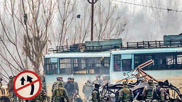 Security personnel inspect the site of the suicide bomb attack in Pulwama on Feb 14, 2019. (PTI File) Security personnel inspect the site of the suicide bomb attack in Pulwama on Feb 14, 2019. (PTI File)