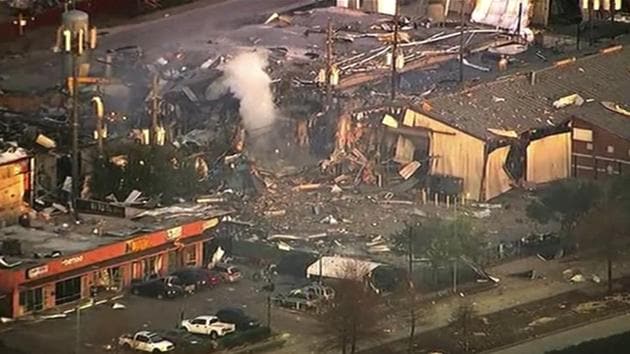 A large explosion left rubble scattered in the area, damaged nearby homes and was felt for miles away. A fire continues to burn and people have been told to avoid the area. (KTRK-TV via AP) (AP photo) A large explosion left rubble scattered in the area, damaged nearby homes and was felt for miles away. A fire continues to burn and people have been told to avoid the area. (KTRK-TV via AP) (AP photo)