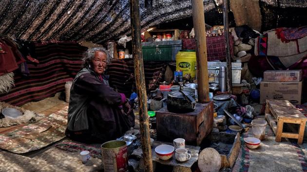 A Changpa nomad looks on inside her tent in a camp. “Right now at the international level, we talk much more about the economic impacts of climate change. But gradually people are realising that we need to look also at the social, cultural and environmental impacts such as the loss of culture, loss of language, loss of territory and loss of biodiversity,” Singh said. (Noemi Cassanelli / AFP)