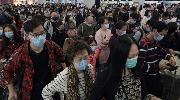 Passengers wearing protective face masks at the departure hall of the high speed train station in Hong Kong on January 23, 2020.(AP Photo) Passengers wearing protective face masks at the departure hall of the high speed train station in Hong Kong on January 23, 2020.(AP Photo)