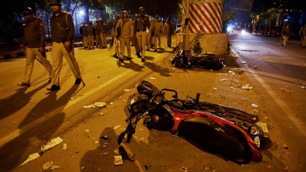 Damaged vehicles near Jamia Millia Islamia University area following violence that erupted against Citizenship Amendment Act, in New Delhi on December 15, 2019.(PTI Photo)