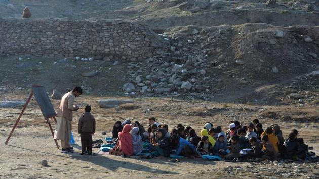 School children take part in a lesson in an open-air classroom in Qarghayi district of Laghman Province. Afghanistan. (Noorullah Shirzada / AFP) School children take part in a lesson in an open-air classroom in Qarghayi district of Laghman Province. Afghanistan. (Noorullah Shirzada / AFP)
