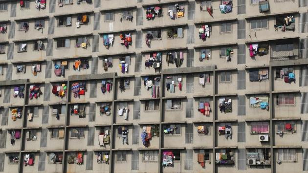 Clothes hung out to dry from the windows of a residential apartment block in Mumbai, Maharashtra. (Rafiq Maqbool / AP) 