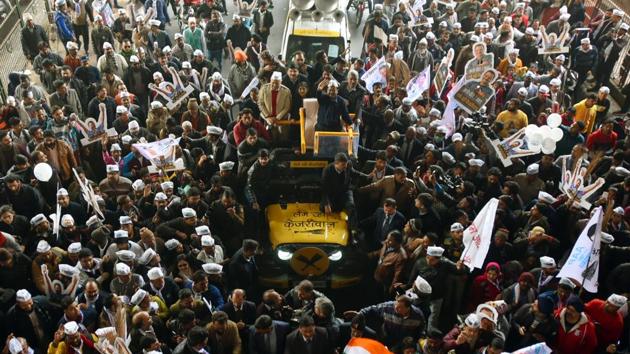 Delhi Chief Minister Arvind Kejriwal along with Deputy Chief Minister Manish Sisodia during a road show en route to filing his nomination papers for the upcoming Delhi assembly elections, in New Delhi. Delays in the rally resulted in the Delhi CM postponing the filing of his nomination to the next day. (Amal KS / HT Photo) 