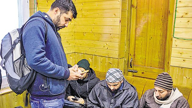 Almost six months after a communication blackout, 2G mobile internet services on post-paid as well as pre-paid cell phone services were restored in the Kashmir Valley on Saturday.(PTI) Almost six months after a communication blackout, 2G mobile internet services on post-paid as well as pre-paid cell phone services were restored in the Kashmir Valley on Saturday.(PTI)